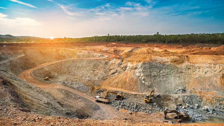 Opencast mining quarry with machinery at work